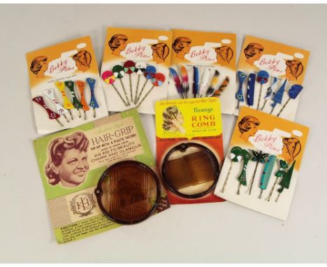 PACKAGING.Two celluloid Ring Combs on printed labels & five various full packs of 1960's hand painted Bobby pins.