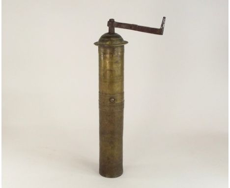 TURKISH GRINDER. An antique Garanti, Turkish brass coffee/pepper mill with folding handle. Height 34cm.