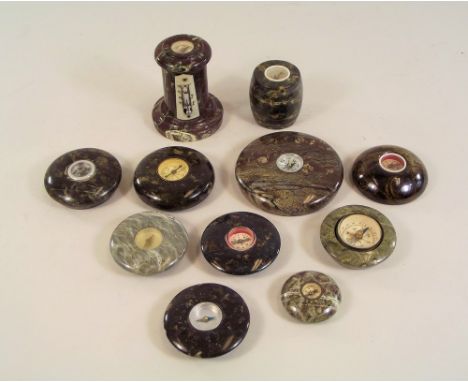 SERPENTINE.A Cornish turned red serpentine column, thermometer/compass & ten other various serpentine compasses.