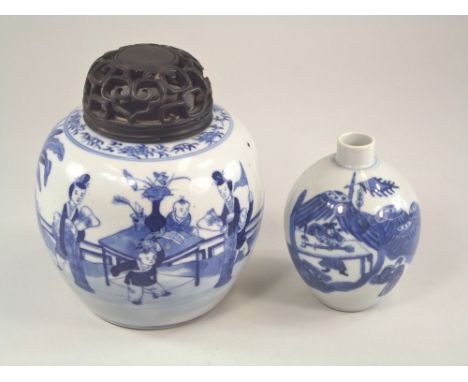 CHINESE PORCELAIN.A 19th century blue & white Chinese porcelain jar with pierced wooden cover, decorated with children playin