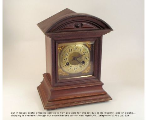 MANTEL CLOCK. An early 20th century oak cased mantel clock. Height 32.5cm.