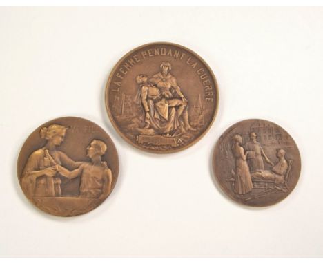 FRENCH WWI MEDALS.Three French bronze WWI period medals: 'La Fils' medal to the French war dead, a women's war nursing medal 