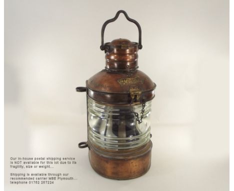 MASTHEAD LAMP. A copper & brass & cast iron masthead lamp, converted to electricity. Full height 58cm.