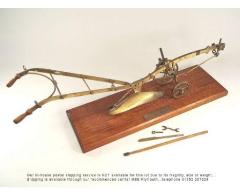 MODEL PLOUGH.A scale model brass plough with presentation plate 'Howard Horse Plough, Champion Single Furrow, Made at Bedford