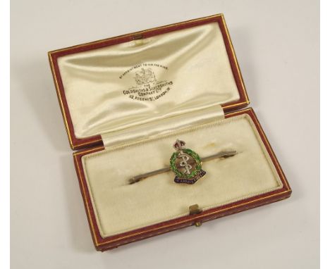 SWEETHEART PIN. A 14ct. gold, platinum & enamelled Royal Army Medical Corps sweetheart pin. 4.5cm. Original box.