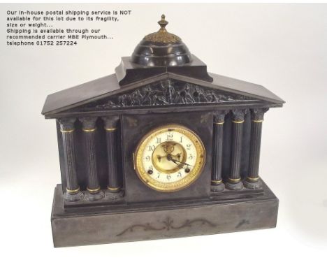 SLATE CLOCK. A large architectural slate mantel clock with figural frieze. Height 42cm. Width 43cm.