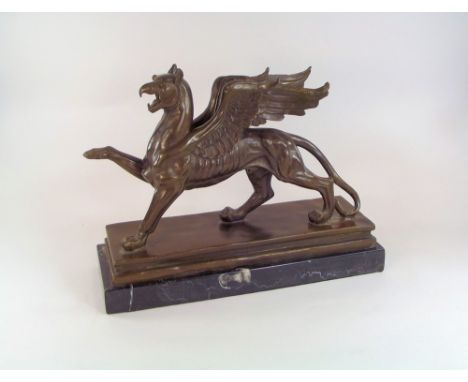 GRIFFIN BRONZE. A large sculptural bronze of a griffin on veined marble base. Unsigned. Width 30 x max. height 33cm.