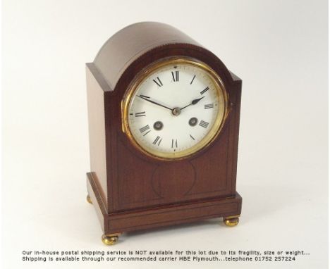 MANTEL CLOCK. An Edwardian inlaid mahogany mantel clock, the French movement stamped G.B. & E. Height 22.5cm.