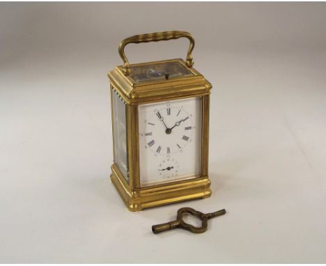 DROCOURT CARRIAGE CLOCK.A gilt brass, gorge cased, repeating carriage/alarm clock by Drocourt of Paris. The dial with Roman a