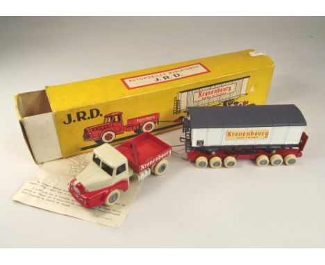 J.R.D. MODEL. A French J.R.D. model No. 123 of a Kronenbourg tractor & trailer load with a railway wagon with box. Model mint