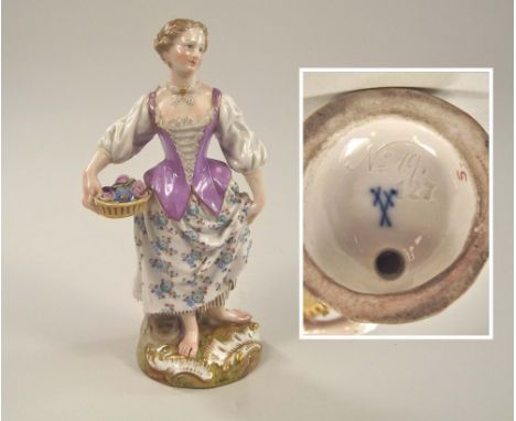 MEISSEN. A Meissen porcelain flower seller figure. Cross swords mark & impressed No. 127, script No. 19.