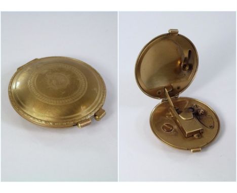 CIGARETTE LIGHTER.A lady's 1930's/40's 'Parker Compact' engine turned, gilt metal cigarette lighter, patented 1939.