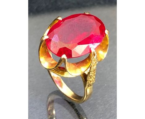 9ct Gold ring set with a large faceted red stone approx 17.7 x 12.2mm (stone tests on electronic tester as a Ruby) 