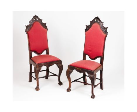 A pair of D.João V chairsRosewood and other timbersCarved decoration with shells and foliage motifsClaw and ball feetTextile 