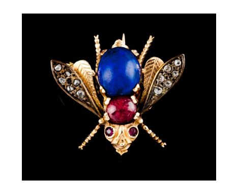A broochSilver and goldFly of body set with cabochon cut lapis lazuli, ruby root and rose cut diamondsSwallow hallmark 375/10