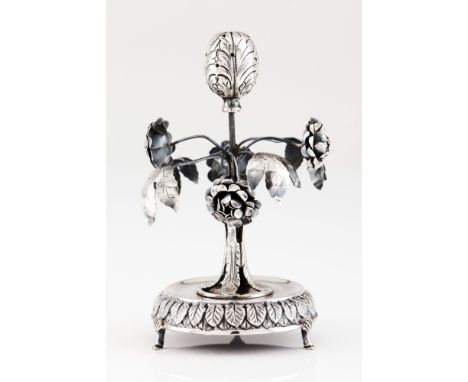 A toothpick holderSilverTree trunk with foliage and flowers surmounted by flower bulb resting on circular stand of engraved f