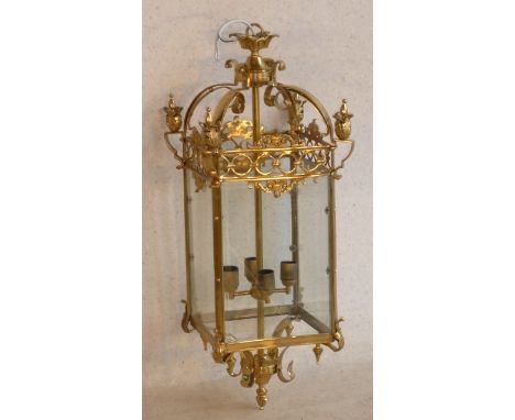 A large 19th Century style (modern) brass Lantern with four hand bevelled glass panels, approx. 90cm high 