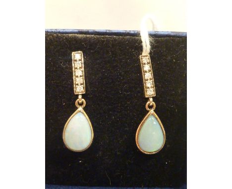 A pair of gold opal and diamond set drop Earrings 