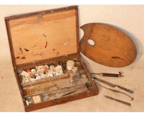 An early 20th Century mahogany Artist's Box, the hinged front opening to reveal removable trays, Artist's pallet, various acc