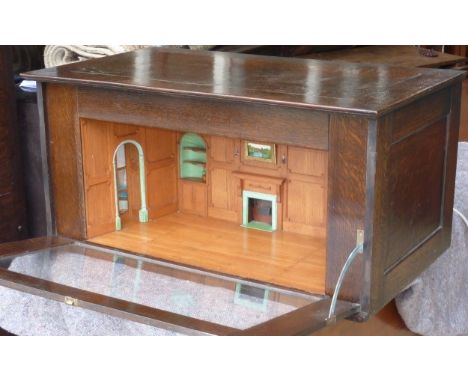 A highly unusual Edwardian oak cased and glazed Dolls House Georgian style Room Interior, the wainscot oak panelling on all w