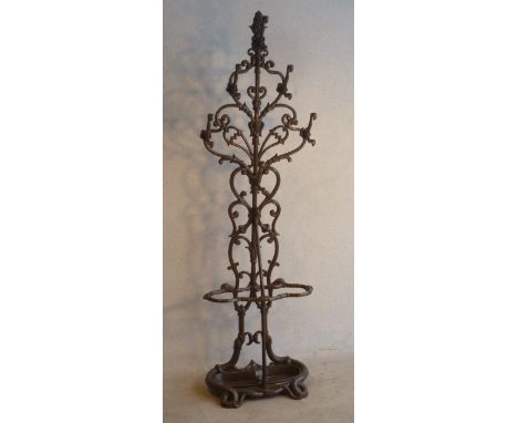 A ornate painted cast iron Stick/Umbrella Stand, the base modelled as two writhing serpents, 174cm high 