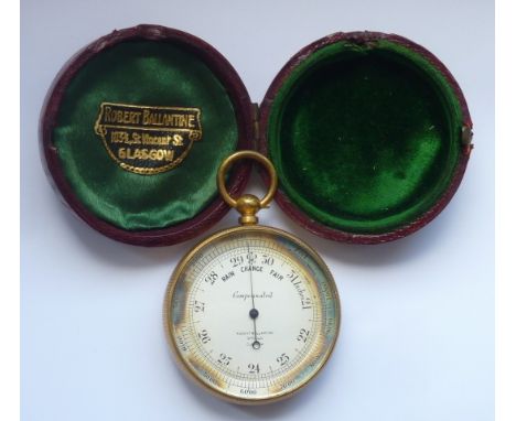 A circular red Morocco cased late 19th/early 20th Century gilt metal Travelling Barometer, the dial signed and the case with 