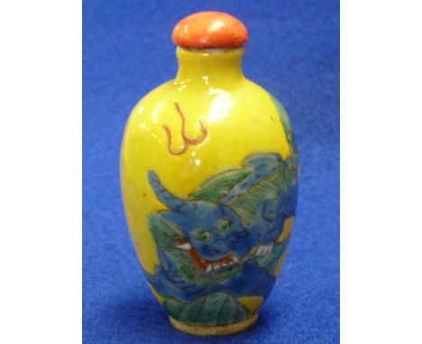 A Chinese ceramic baluster shaped 18th/19th Century Snuff Bottle and Cover, hand decorated with a Qilin flying amongst stylis