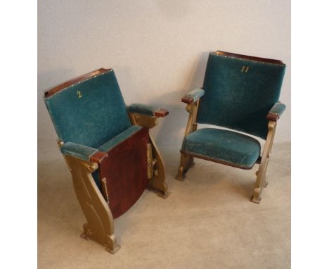A pair of Art Deco style upholstered and gold coloured cast iron Theatre Chairs, each individually numbered and originally fr