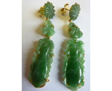 A pair of carved jade and 18 carat yellow gold drop Earrings, decorated with an elongated fruit and flower heads etc., length