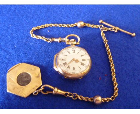 A ladies gold cased open faced Fob Watch, the white enamel dial with Roman numerals, the back of the case with large monogram