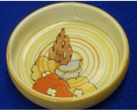 A 1920's/30's Clarice Cliff circular ceramic Pin Tray hand decorated in typical fashion, stamps to underside, (large crack ru