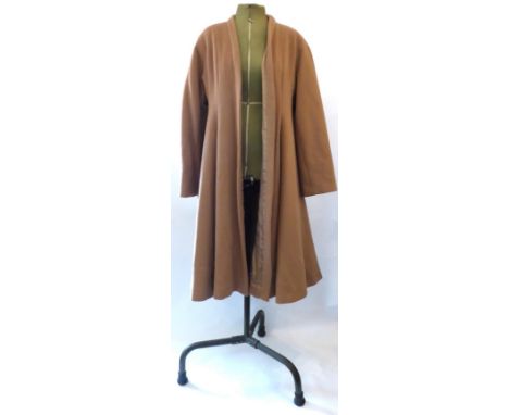A Christian Dior Boutique Camel Coloured Wool Coat, of swing style, label numbered '07705', size 38   