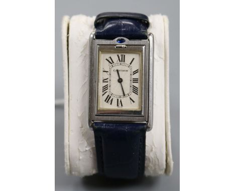A gentleman's 2004 stainless steel Cartier Tank Basculante reverso manual wind wrist watch, ref. 2390, on associated strap, w
