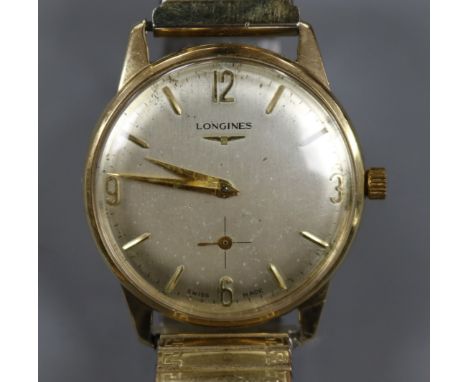 A gentleman's 9ct gold Longines manual wind wrist watch, on associated flexible strap, with case back inscription.