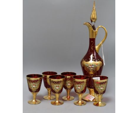 A Bohemian ruby glass and gilt claret jug and six glasses