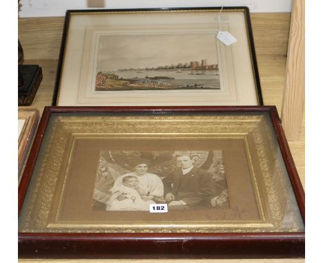 A framed Edwardian family photograph and a print of Lambeth from Millbank