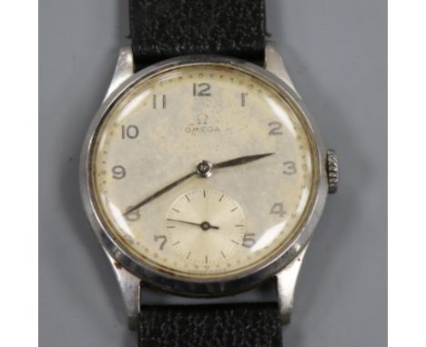 A gentleman's late 1940's stainless steel Omega manual wind wrist watch, movement c. 30T2 PC, on later associated strap.