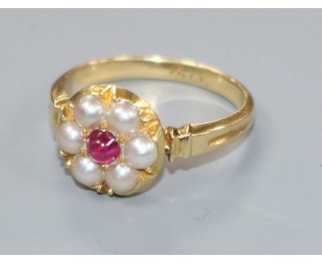 An early 20th century 18ct gold, cabochon ruby and split pearl cluster ring, size M.
