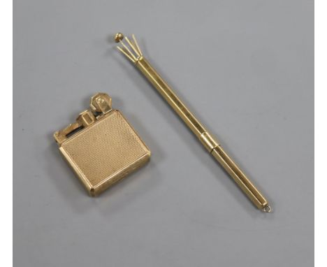 A small 1930's engine turned 9ct gold mounted lighter and a let 9ct gold swizzle stick.