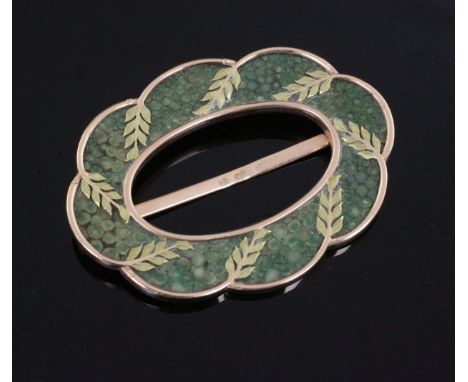 FABERGE: A late 19th/early 20th century two colour 56 zolotnik gold and shagreen buckle, of cusped oval form with curved leaf