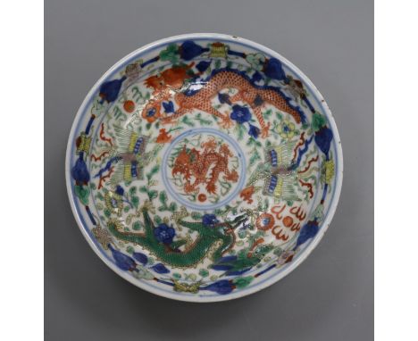 A Chinese wucai 'dragon and phoenix' saucer dish, Kangxi mark, 19th century diameter 13.5cm