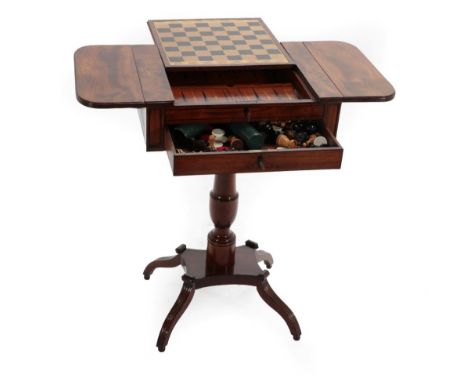 A Regency Mahogany and Ebony Strung Pedestal Gaming Table, early 19th century, the sliding chess top tray opening to reveal b