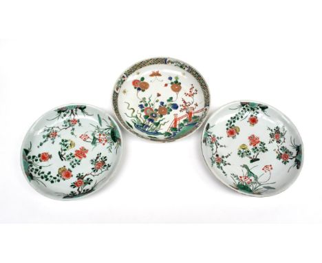  ~ A Chinese Porcelain Saucer Dish, Kangxi, painted in famille verte enamels with chrysanthemums in a fenced garden within a 