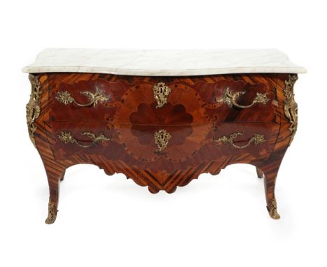  ~ A Louis XV Kingwood and Calamander Bombé Commode, late 18th century, with white serpentine shaped marble above two long dr