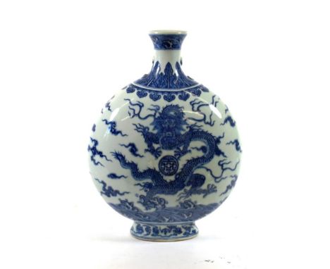 A Chinese Porcelain Moon Flask, Qing Dynasty, probably Qianlong, painted in underglaze blue with dragons amongst cloud scroll