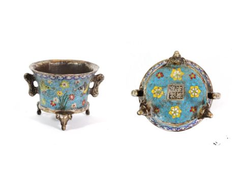 A Chinese Cloisonné Enamel Censer, of flared cylindrical form with scroll handle and elephant's mask feet, decorated with but