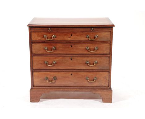 A George III Mahogany and Crossbanded Straight Front Bachelor's Chest, late 18th century, the moulded top above a pull-out br
