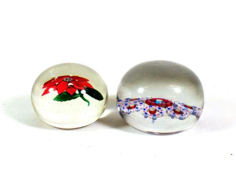 A Baccarat Patterned Millefiori Paperweight, circa 1850, with central goat silhouette cane within a border of red canes and s