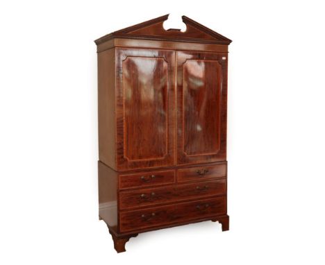  ~ A George III Mahogany and Satinwood Banded Linen Press, early 19th century, the dentil and architectural pediment above tw