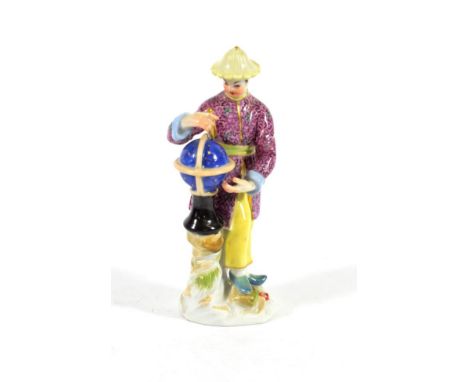 A Meissen Porcelain Figure of a Chinese Astronomer, 20th century, standing beside a globe holding a pair of callipers, on a m